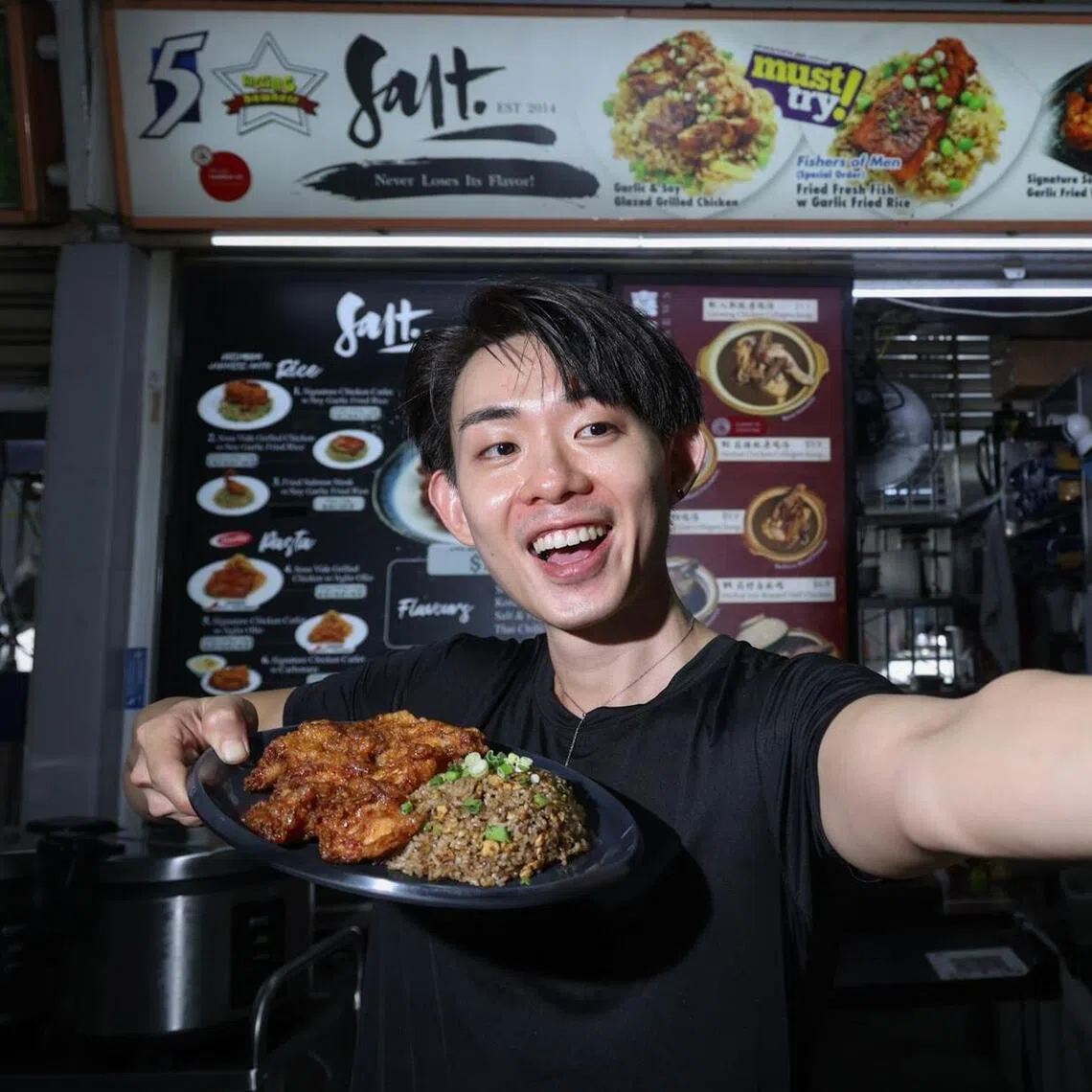 Stall owner Kenny Ngoo generates content for his stall’s social media accounts. 
