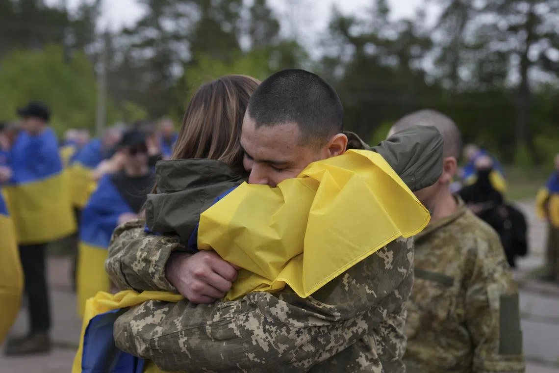 Ukrainian prisoners of war returning home on May 6, in the 64th such swop since the start of Russia's invasion of its neighbour in February 2022.