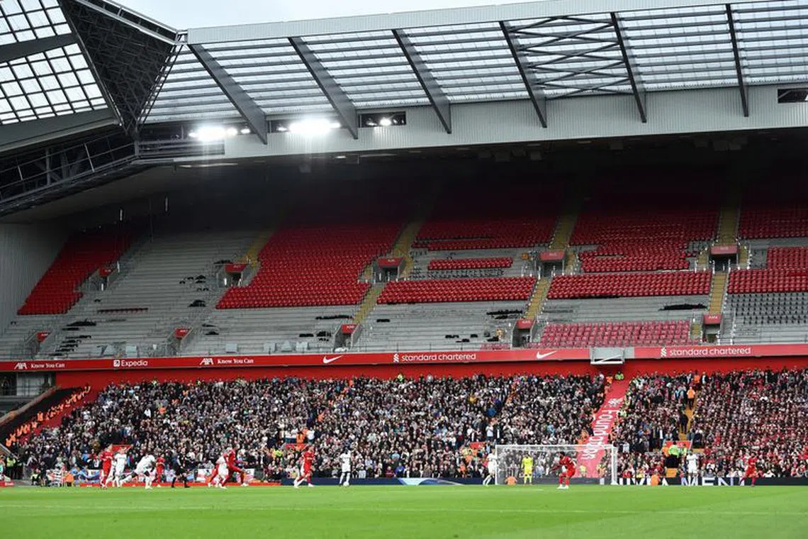 FILE PHOTO: Soccer Football - Premier League - Liverpool v West Ham United - Anfield, Liverpool, Britain - September 24, 2023 General view of empty seats inside the Anfield Road Stand during the match REUTERS/Peter Powell /File Photo