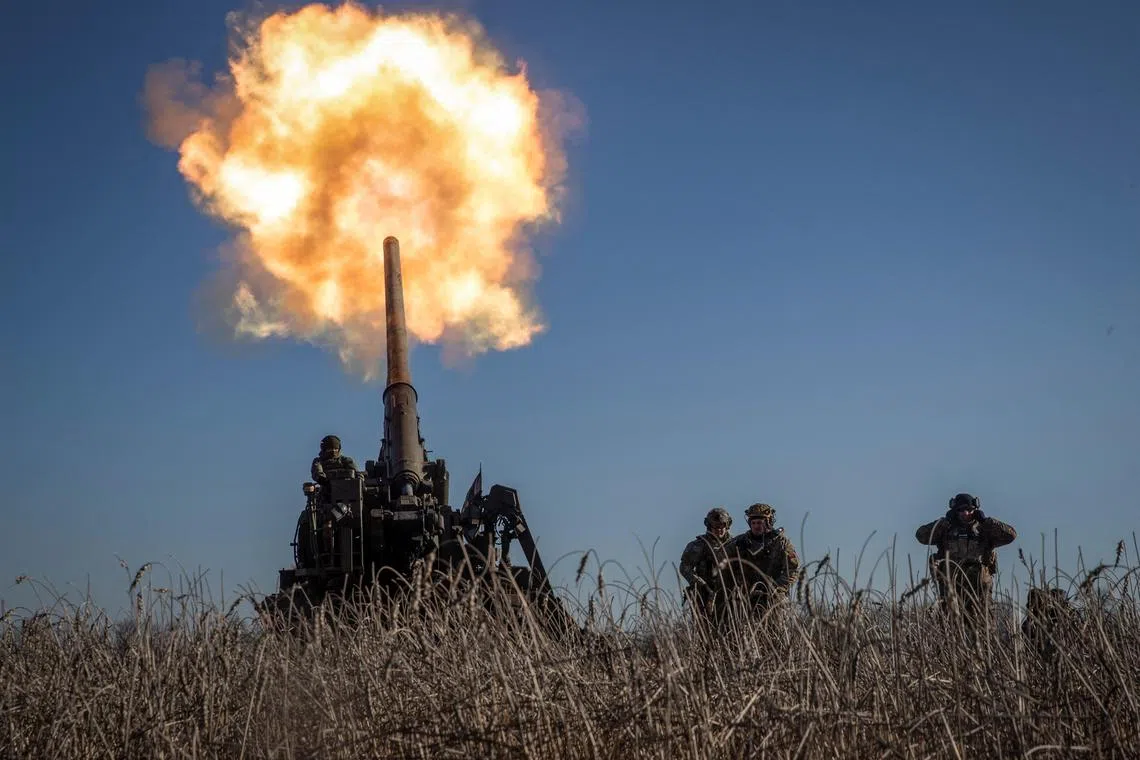 Ukrainian servicemen fire a 2S7 Pion self-propelled gun towards Russian positions, on the front line near Bakhmut, in Ukraine's Donetsk region, on Jan 24, 2023.