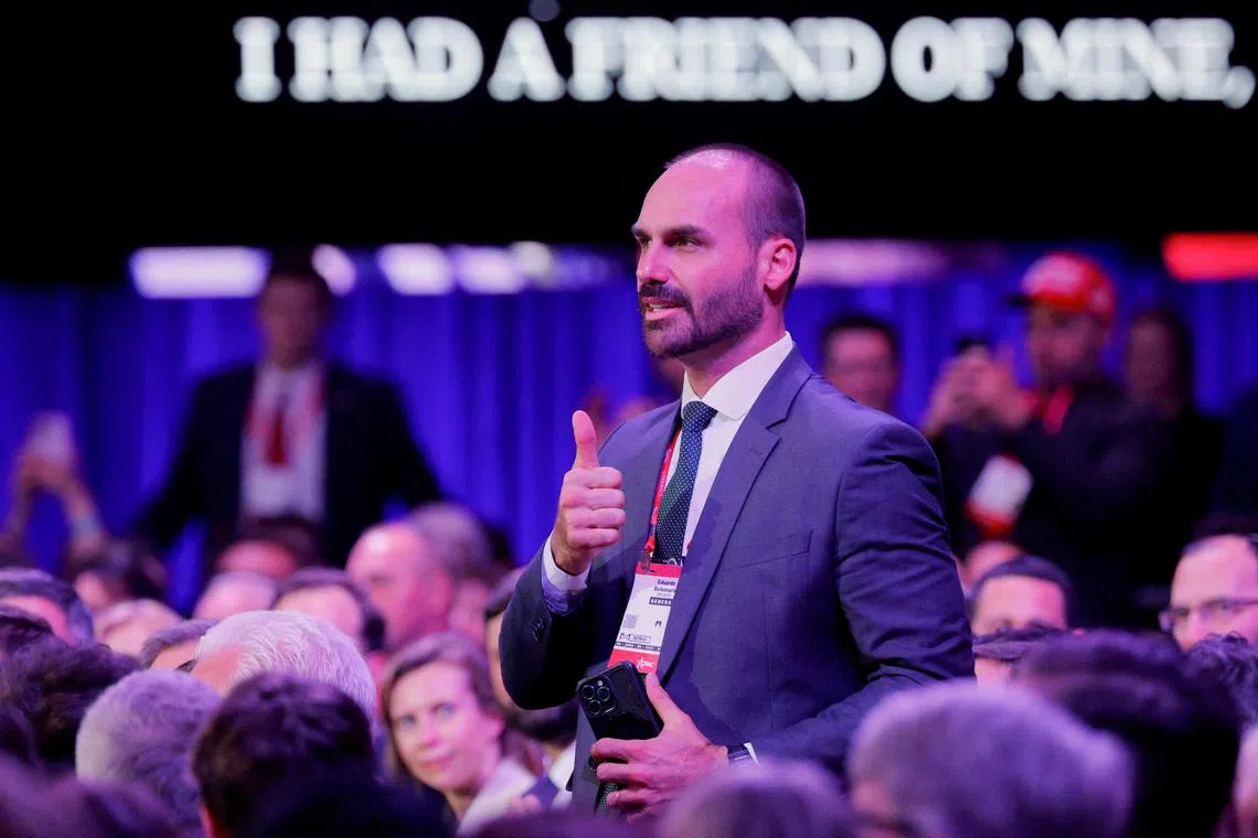 FILE PHOTO: Eduardo Bolsonaro, a member of Brazil's National Congress and a son of former Brazilian President Jair Bolsonaro, gestures in the audience as U.S. President Donald Trump addresses the Conservative Political Action Conference (CPAC) annual meeting in National Harbor, Maryland, U.S., February 22, 2025. REUTERS/Brian Snyder/File Photo
