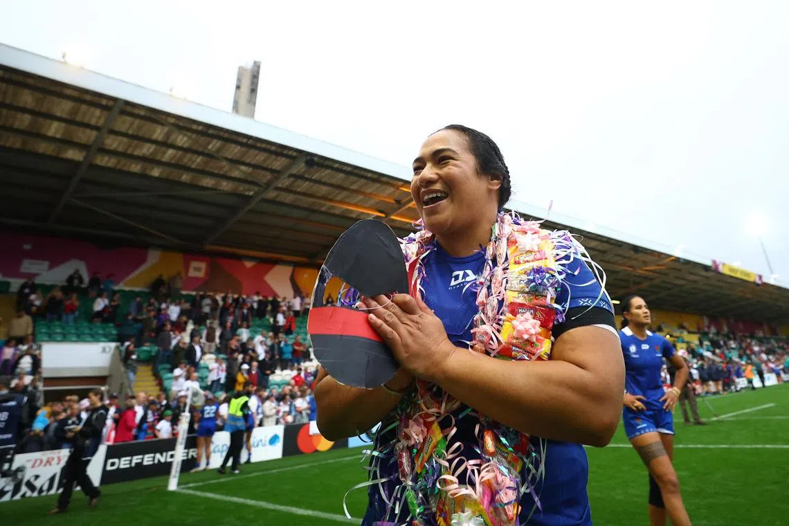 Samoa's Nina Foaese salutes their fans after the match against England.