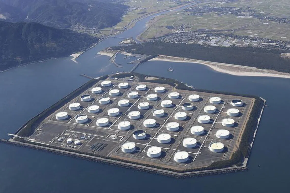 FILE PHOTO: An aerial view shows Shibushi National Petroleum Stockpiling Base in Kagoshima prefecture, Japan January 18, 2019, in this photo taken by Kyodo. Picture taken on January 18, 2019.  Mandatory credit Kyodo/via REUTERS ATTENTION EDITORS - THIS IMAGE WAS PROVIDED BY A THIRD PARTY. MANDATORY CREDIT. JAPAN OUT. NO COMMERCIAL OR EDITORIAL SALES IN JAPAN./File Photo