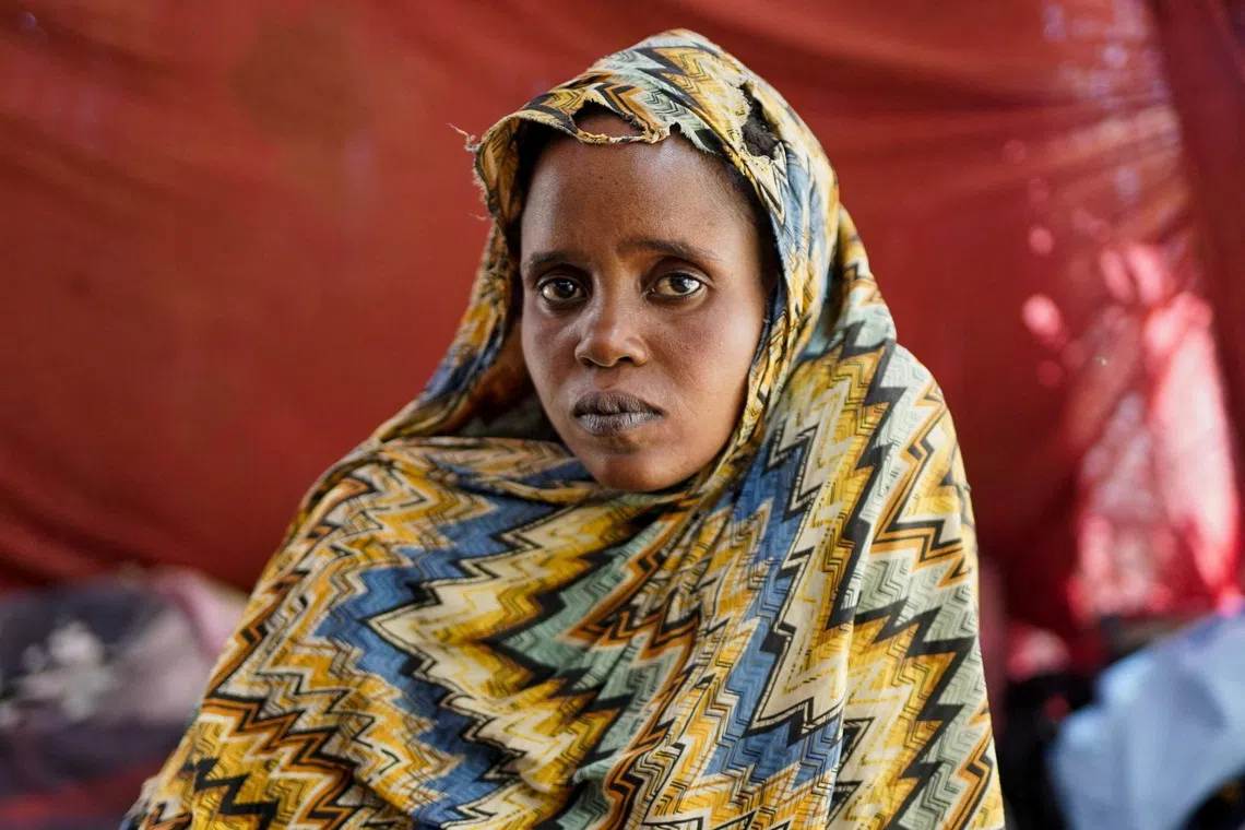 Israa Mukhtar, a witness of the RSF attack in April 2025 on Relief International's medical clinic in Sudan's Zamzam camp, sits inside a tent, in Tawila, North Darfur, Sudan, June 13, 2025. REUTERS/Stringer