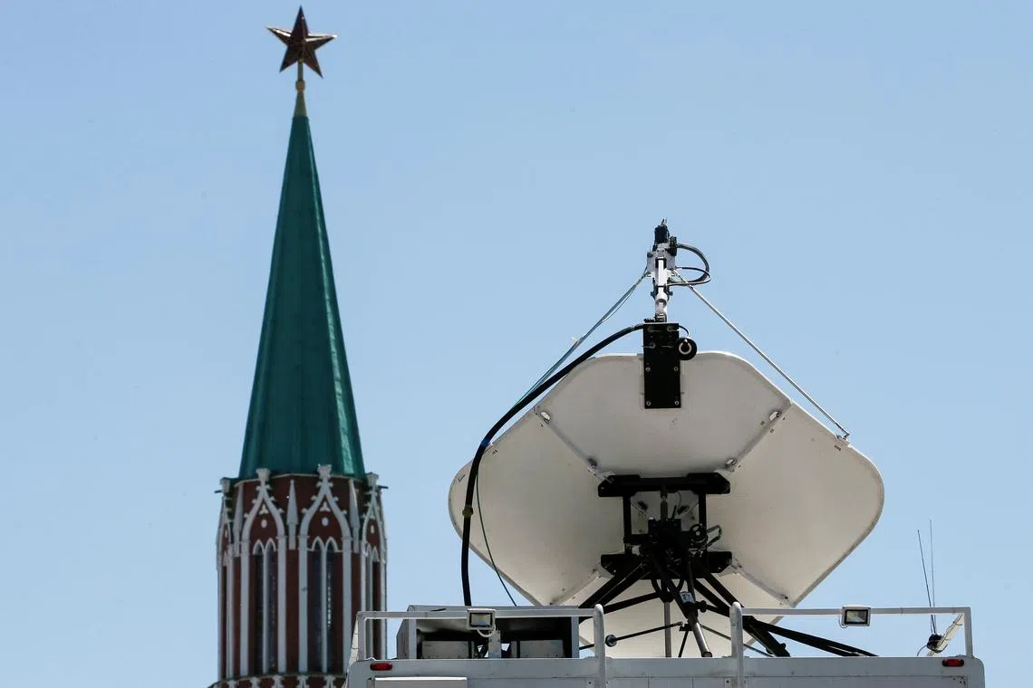 Vehicles of Russian state-controlled broadcaster Russia Today (RT) are seen near the Red Square in central Moscow, Russia June 15, 2018. Picture taken June 15, 2018.  REUTERS/Gleb Garanich/File Photo