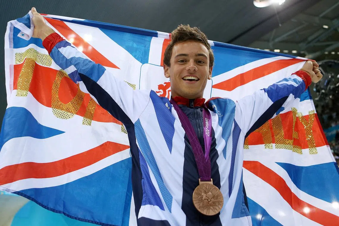 FILE PHOTO: Olympics - London 2012 Olympic Games - Aquatics Centre - 11/8/12   Diving - Men's 10m Platform Final - Great Britain's Tom Daley celebrates celebrates with his Bronze medal    Mandatory Credit: Action Images / Steven Paston   Livepic   PLEASE NOTE: FOR EDITORIAL USE ONLY/File Photo