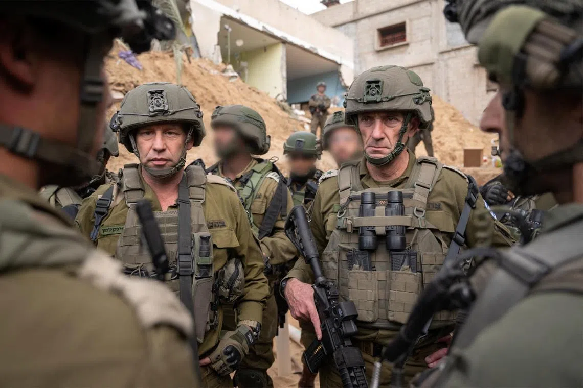 Israel’s Chief of Staff Herzi Halevi (centre, right) told reporters in a televised statement on the Gaza border that the war would go on “for many months”.