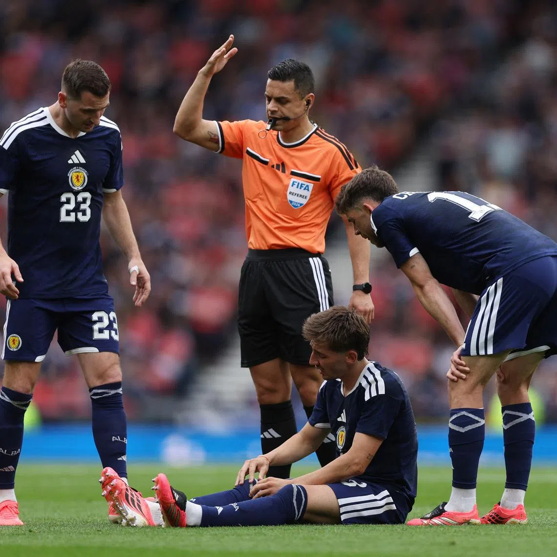 Soccer Football - International Friendly - Scotland v Curacao - Hampden Park, Glasgow, Scotland, Britain - May 30, 2026 Scotland's Billy Gilmour reacts as Kenny McLean, Ryan Christie and referee Goga Kikacheishvil look over REUTERS/Russell Cheyne