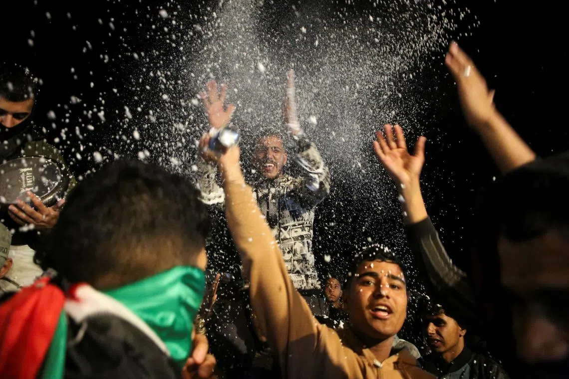 Palestinians reacting to news of a ceasefire deal with Israel, in Khan Younis in the southern Gaza Strip, on Jan 15.