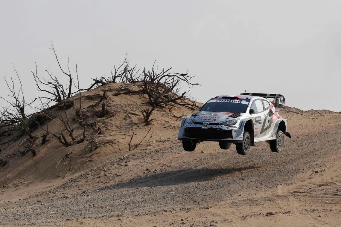 French driver Sebastien Ogier and his French co-driver Vincent Landais compete in their Toyota GR Yaris in stage 5 of the FIA World Rally Championship (WRC) in Jeddah on Nov 27, 2025.
