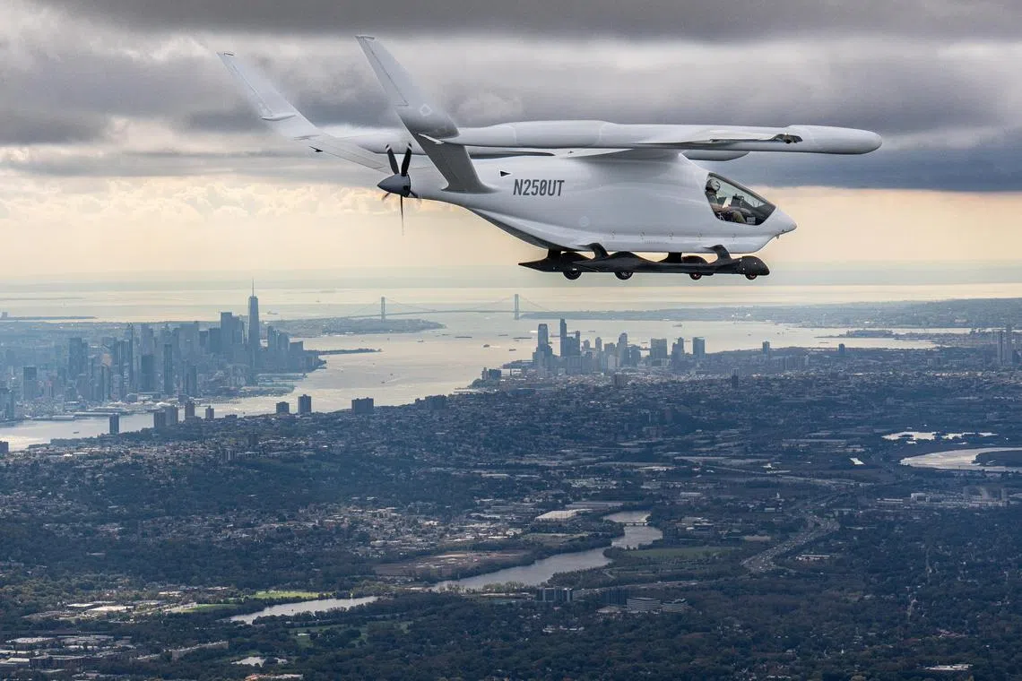 The CX300, an experimental electric airplane built by Beta Technologies, flying from Westchester, N.Y. to Reading, Pa. during a 16 day trip down the East Coast, in New York on Oct. 17, 2023. When the journey came to an end in Florida, Beta handed the plane over to the Air Force, which will experiment with it over the next few months. (Tony Cenicola/The New York Times)