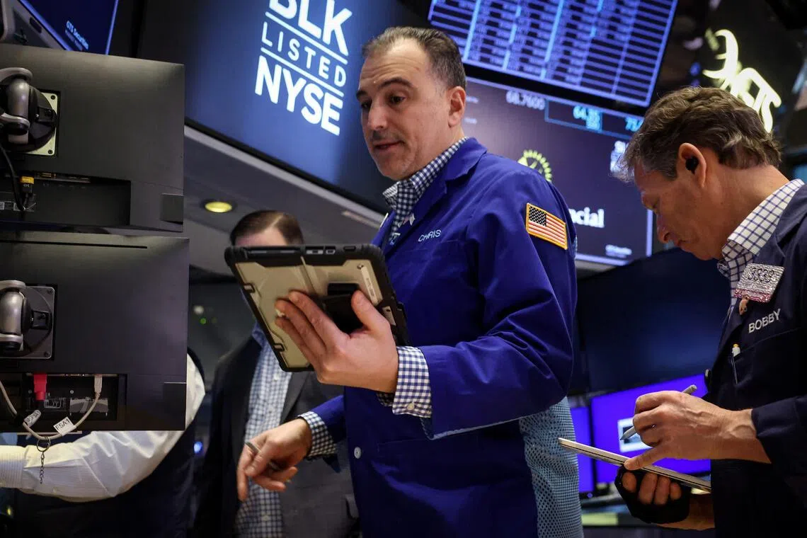 Traders working on the floor of the New York Stock Exchange, in New York City, on Feb 13.