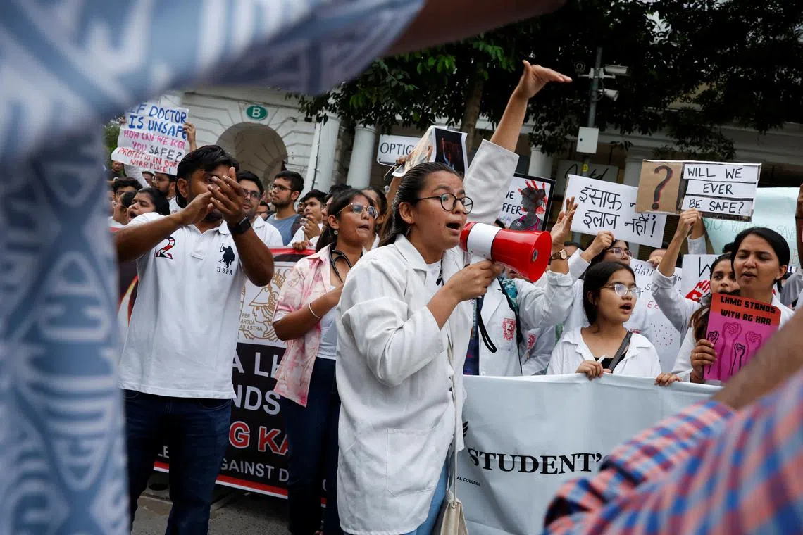 FILE PHOTO: Doctors shout slogans as they hold placards during a protest rally demanding justice following the rape and murder of a trainee medic at a hospital in Kolkata, in New Delhi, India, August 18, 2024. REUTERS/Priyanshu Singh/File Photo