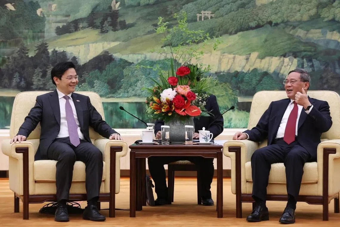 DPM Lawrence Wong (left) and Chinese Premier Li Qiang at their meeting in Singapore in May. 