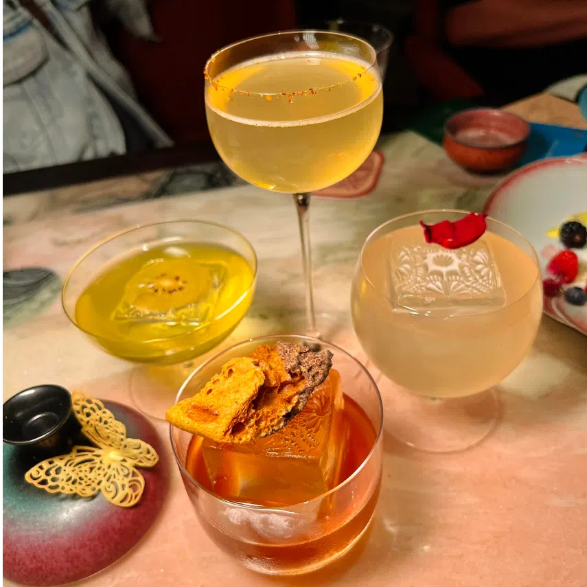 Cocktails at Suma Bar (left) and mushrooms on sale at Zhuanxin Farmers' Market (right).
