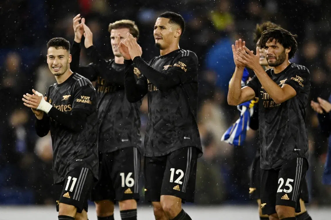 Arsenal's Gabriel Martinelli, Rob Holding, William Saliba and Mohamed Elneny celebrate after the match.