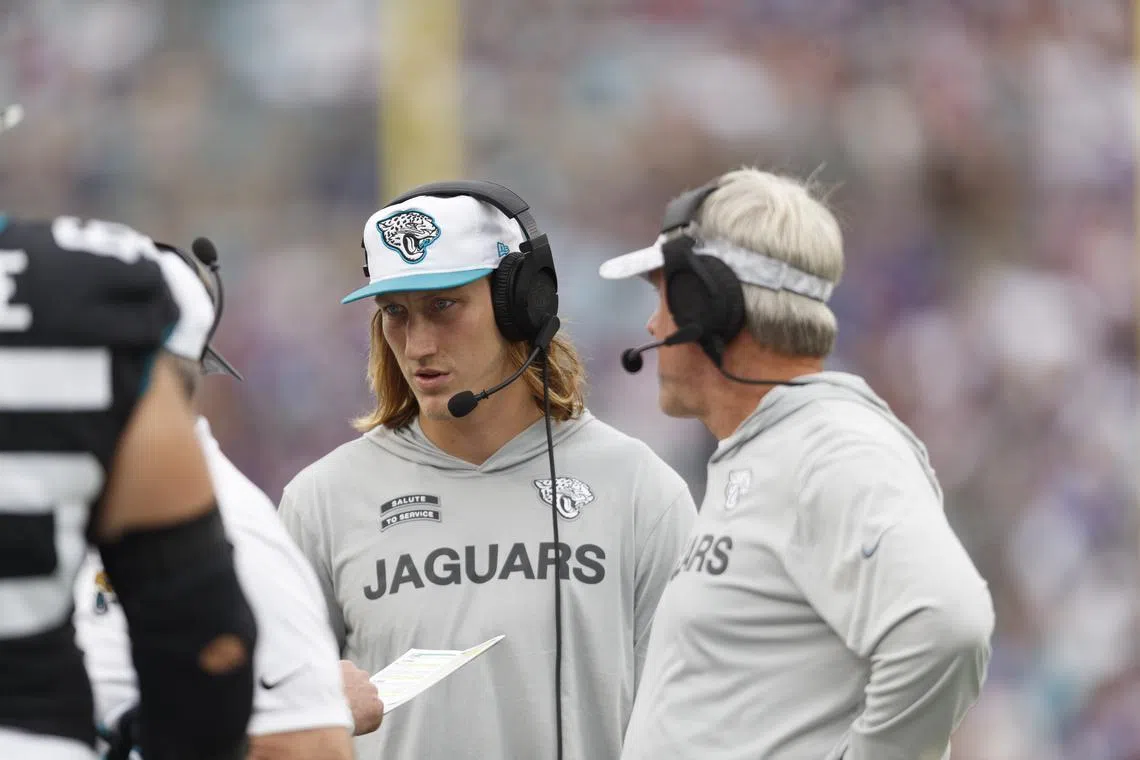 Nov 10, 2024; Jacksonville, Florida, USA; Jacksonville Jaguars quarterback Trevor Lawrence (16) and head coach Doug Pederson during the game against the Minnesota Vikings during the fourth quarter at EverBank Stadium. Mandatory Credit: Morgan Tencza-Imagn Images