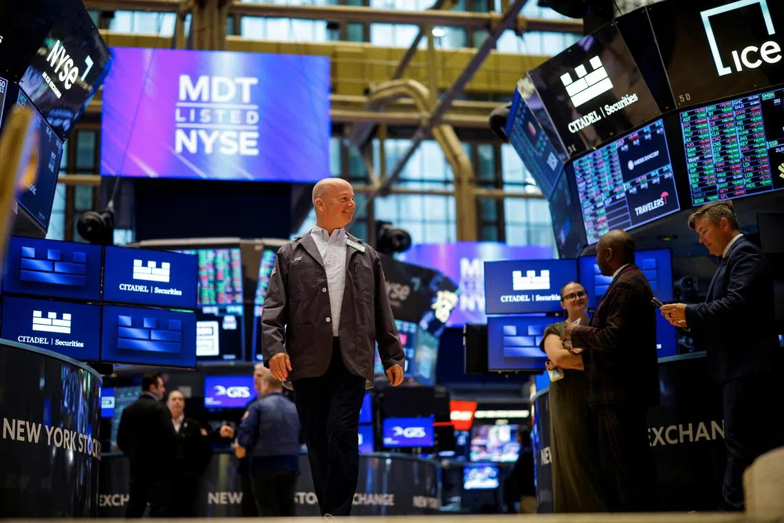 Traders work on the floor of the New York Stock Exchange, in New York City.