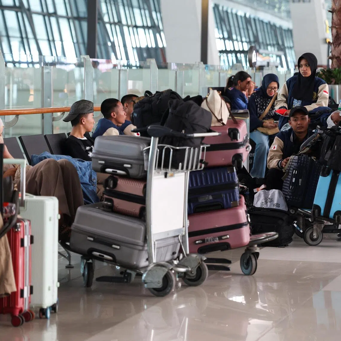 Stranded passengers at Soekarno Hatta-International Airport in Indonesia on Sept 7 as it shut operations due Mount Anak Krakatau’s eruption.