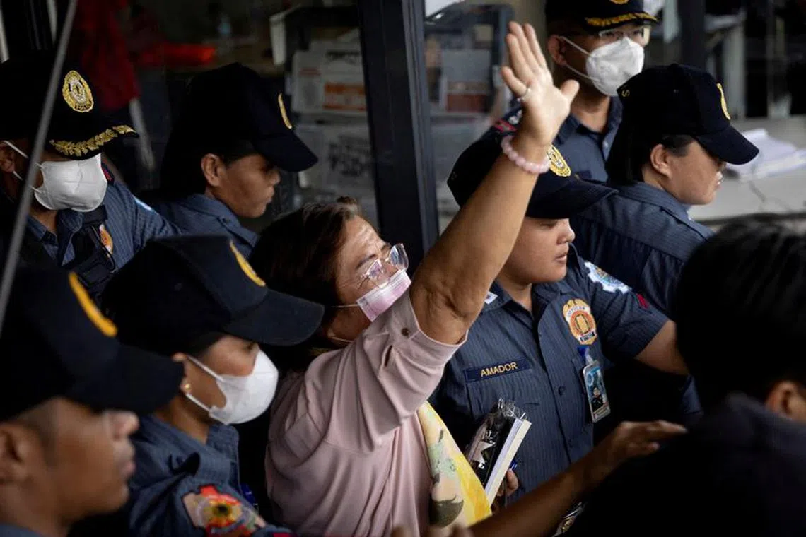 FILE PHOTO: Former Philippines senator Leila de Lima walks out of the Muntinlupa Hall of Justice surrounded by police, after a hearing on a drugs charge in Muntinlupa, Philippines, June 5, 2023. REUTERS/Eloisa Lopez/File Photo