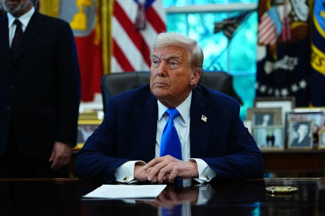 US President Donald Trump speaks to members of the media in the Oval Office of the White House in Washington, DC, US, on Friday, Sept. 19, 2025. Trump is signing a proclamation that would move to extensively overhaul the H-1B visa program, requiring a $100,000 fee for applications in a bid to curb overuse, according to a White House official familiar with the matter. Photographer: Aaron Schwartz/CNP/Bloomberg