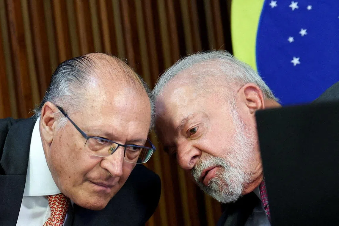 FILE PHOTO: Brazilian President Luiz Inacio Lula da Silva (right) talks with Vice President Geraldo Alckmin during a ministerial meeting at the Planalto Palace in Brasilia, Brazil, March 31, 2026. REUTERS/Adriano Machado/File Photo