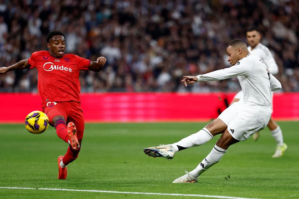 Kylian Mbappe scoring the first goal in Real Madrid's 4-2 La Liga win over Sevilla at the Santiago Bernabeu on Dec 22.