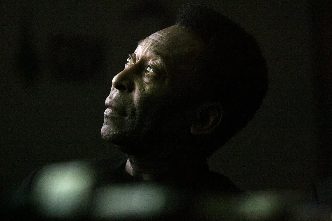 In this file photo taken on June 25, 2008, Brazilian soccer legend Edson Arantes do Nacimento, known as Pele, looks on as he attends the opening ceremony of the "Marks of the King" exhibition in Brasilia. 