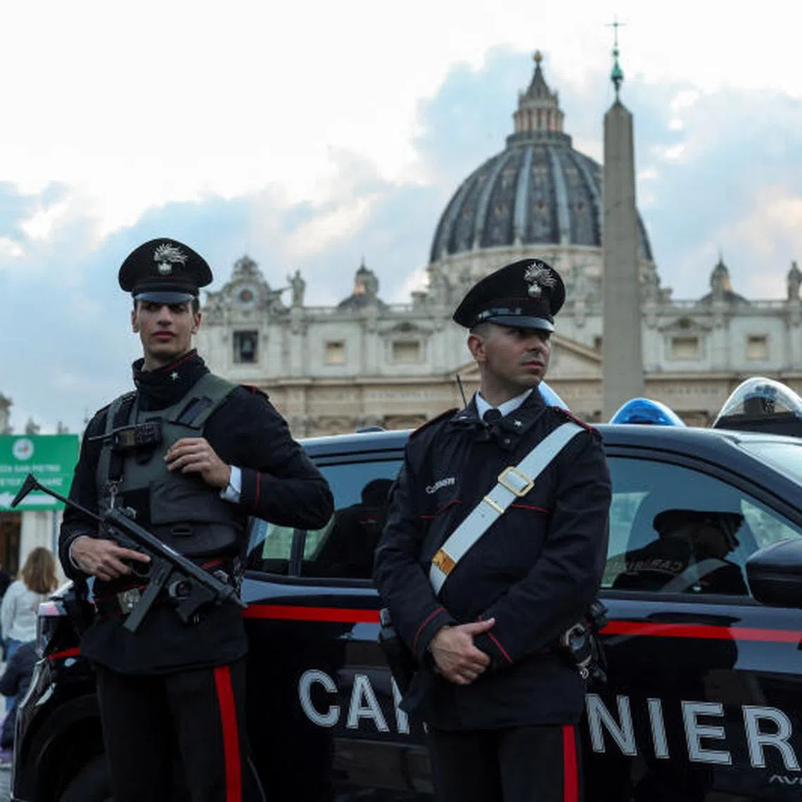 Members of the Carabinieri stand near St. Peter's Square at the Vatican, ahead of the conclave to elect the next pope, as seen from Rome, Italy, May 5, 2025. REUTERS/Marko Djurica