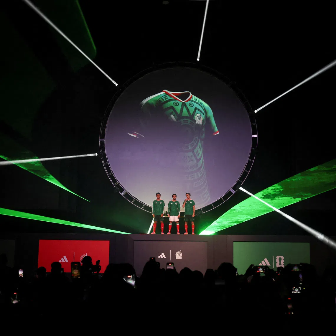 Players of the Mexican national football team, Henry Martin, Ramon Juarez and Marcel Ruiz pose with the Mexico national team's new jersey during an event by Adidas, ahead of the 2026 World Cup, in Mexico City, Mexico, November 5, 2025. REUTERS/Henry Romero