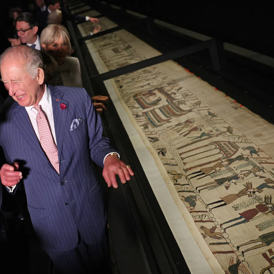 Britain's King Charles and France's President Emmanuel Macron react during a preview event for the Bayeux Tapestry Exhibition, at British Museum in London, Britain, September 2, 2026.  Adrian Dennis/Pool via REUTERS