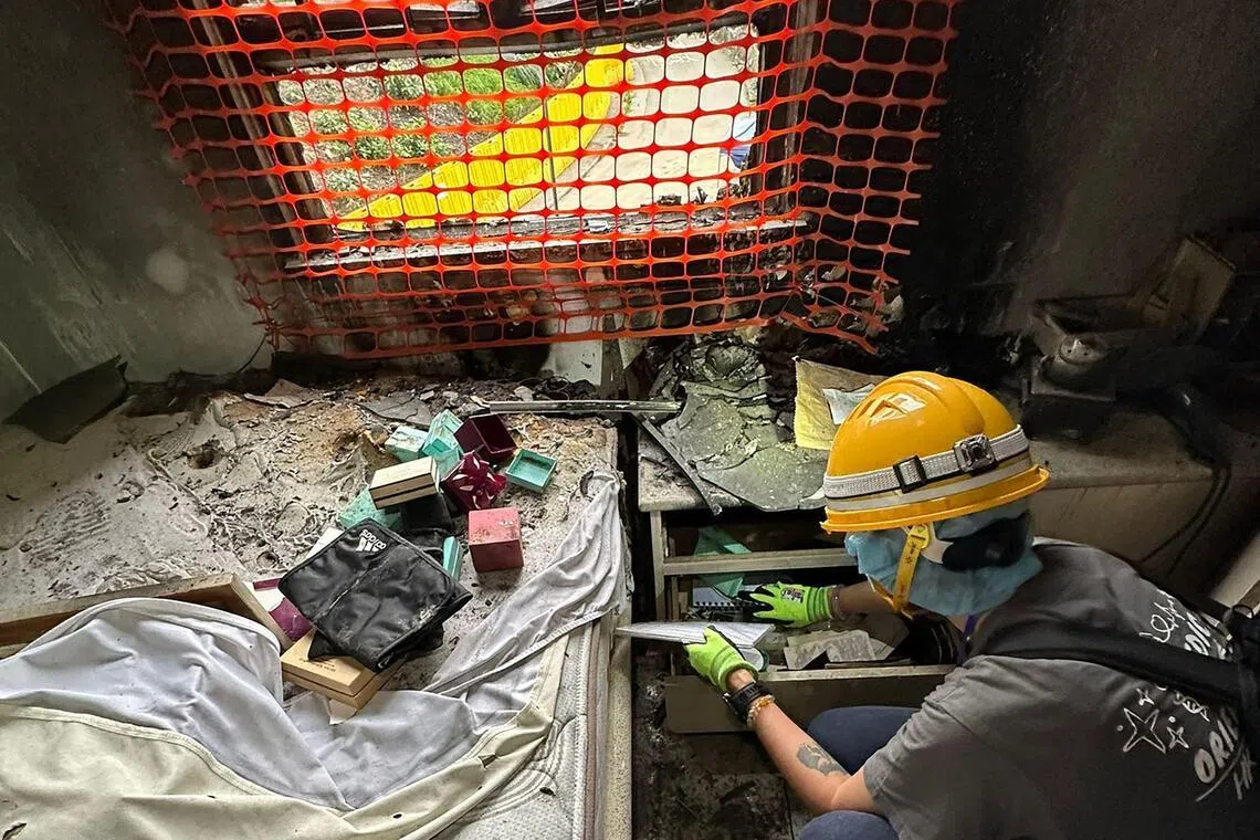 Photos, clothes, ashes: Hongkongers pick through fire-ravaged homes