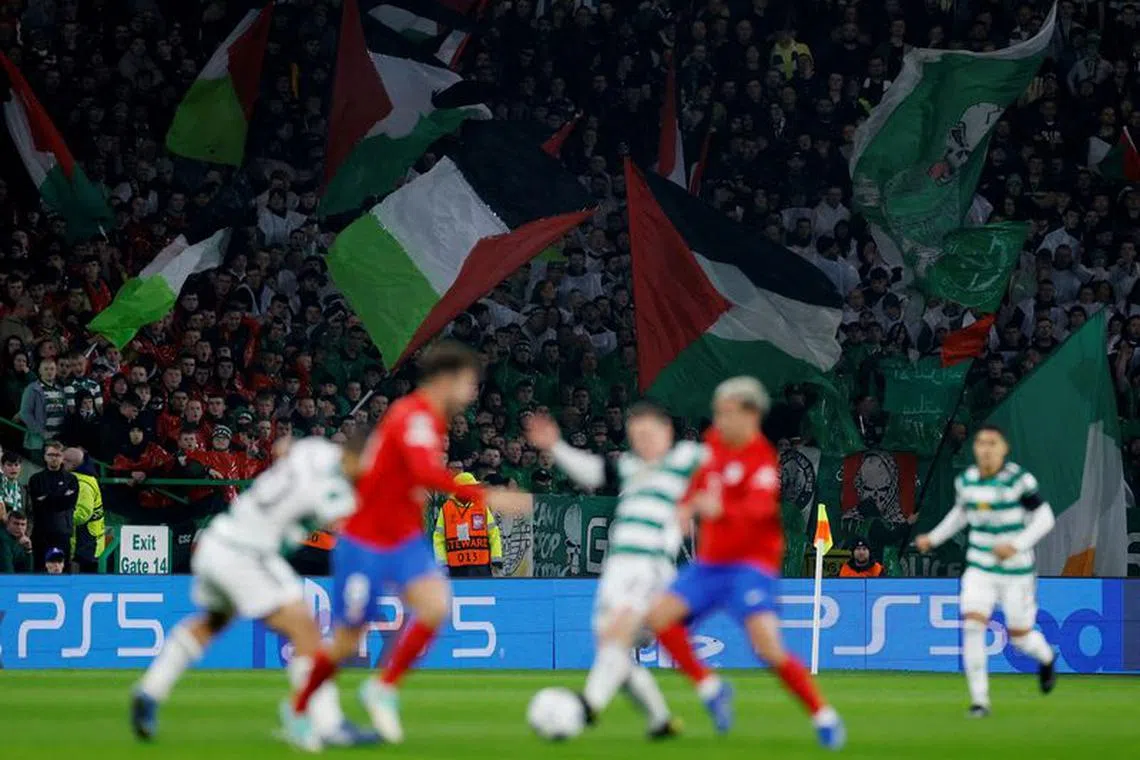 Soccer Football - Champions League - Group E - Celtic v Atletico Madrid - Celtic Park, Glasgow, Scotland, Britain - October 25, 2023 Celtic fans wave flags in support of Palestine amid the ongoing conflict between Israel and the Palestinian Islamist group Hamas Action Images via Reuters/Jason Cairnduff/ File photo