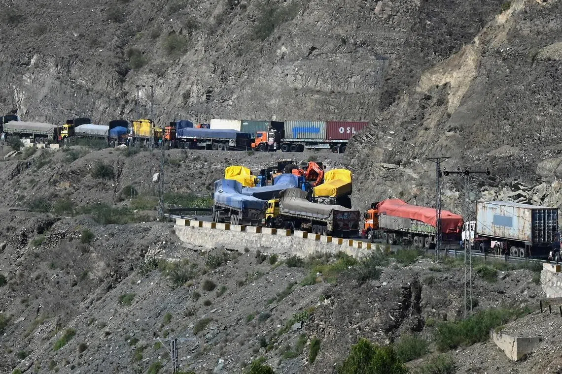 Trucks carrying goods destined for Afghanistan line up as they wait for the opening of the border following clashes between security forces of Pakistan and Afghanistan on Oct 13.