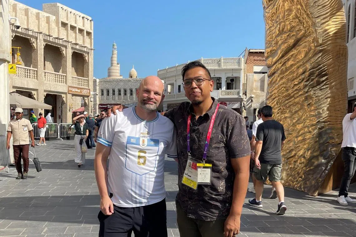 ST sports correspondent Sazali Abdul Aziz (left), with sports business group leader for Deloitte South-east Asia James Walton, at Souq Waqif marketplace in Qatar.
