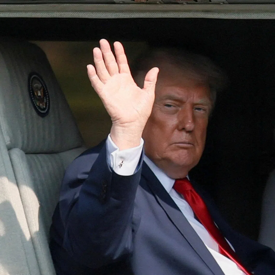 U.S. President Donald Trump waves aboard Marine One in Carlisle, Pennsylvania, U.S., July 15, 2026. REUTERS/Kylie Cooper