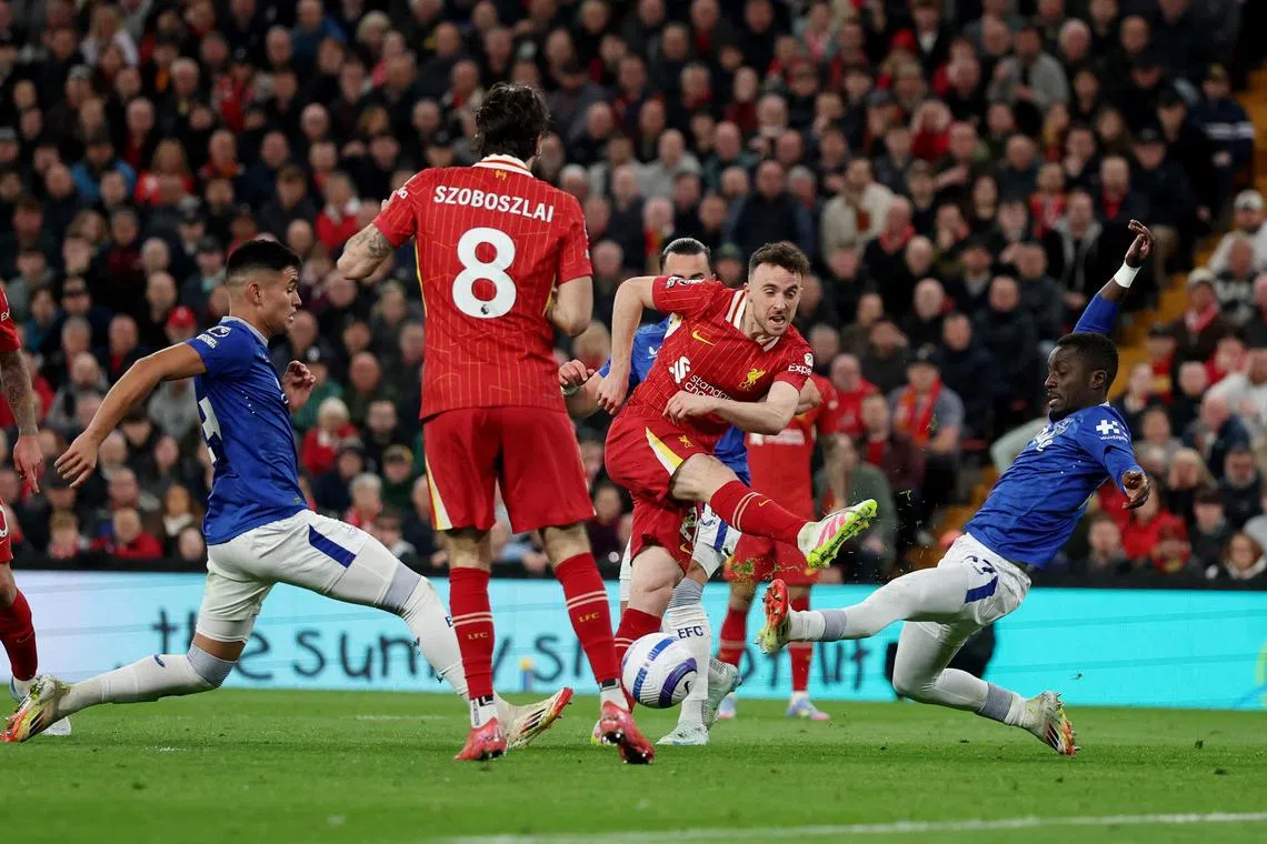 Soccer Football - Premier League - Liverpool v Everton - Anfield, Liverpool, Britain - April 2, 2025 Liverpool's Diogo Jota shoots at goal REUTERS/Phil Noble