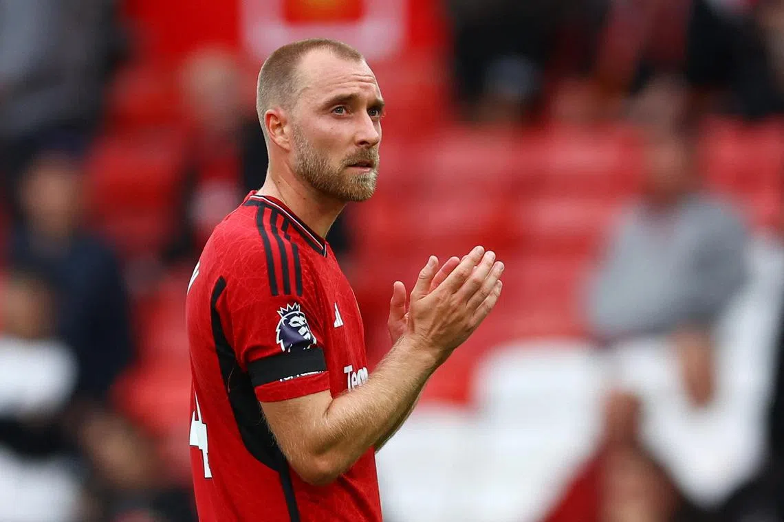 A dejected Christian Eriksen applauds the fans after Manchester United's match against Brighton.