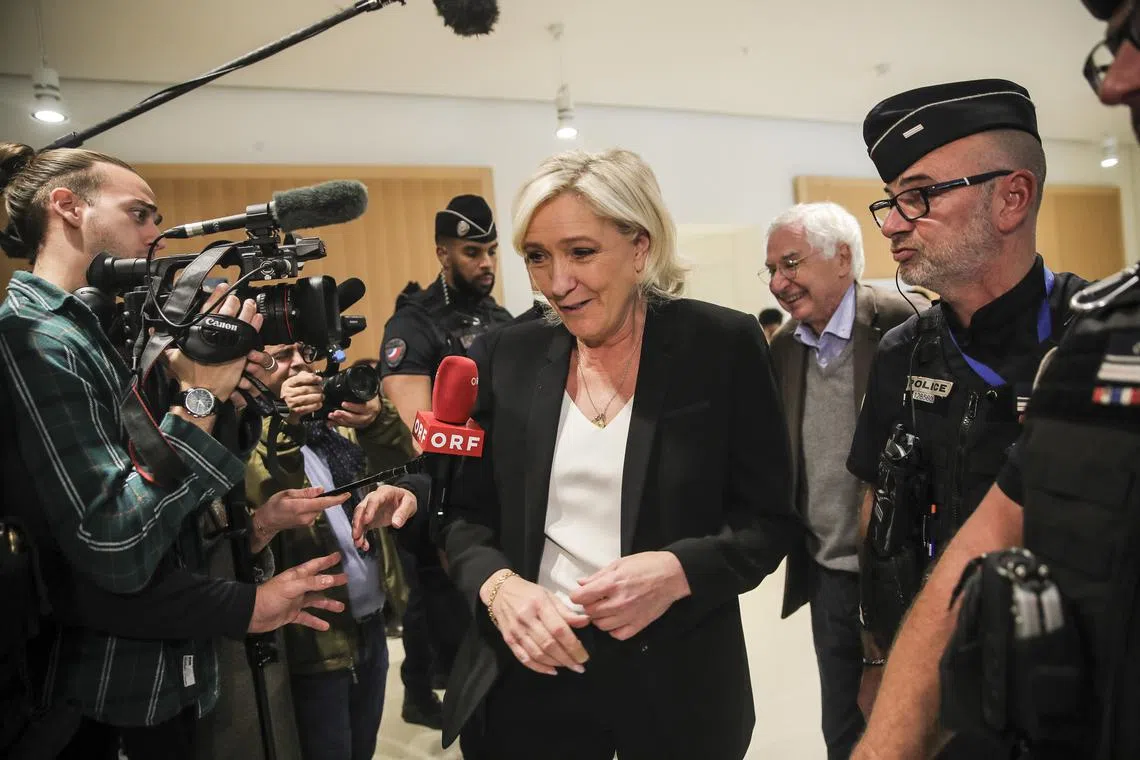 Ms Marine Le Pen and two dozen other National Rally party chiefs are accused of embezzling European Parliament money by creating fake jobs.