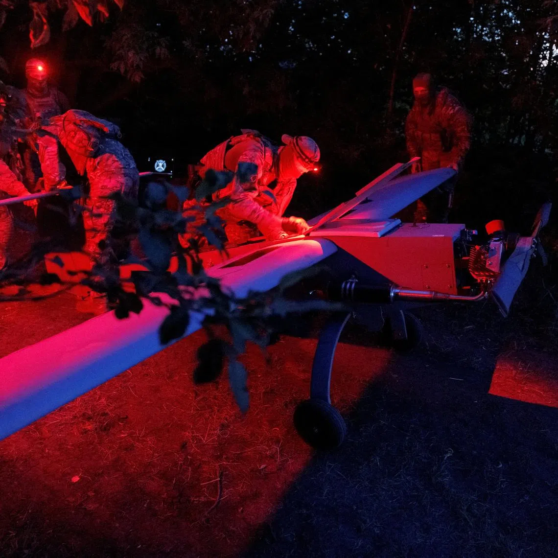 Service members of the Sparta company of the 422nd Unmanned Systems Regiment 'Luftwaffe' of the Ukrainian Armed Forces, prepare a Zozulia mid-strike drone for a flight while they work at a position near a front line, amid Russia's attack on Ukraine, in an undisclosed location in Southern Ukraine, on an undisclosed date, 2026. REUTERS/Valentyn Ogirenko