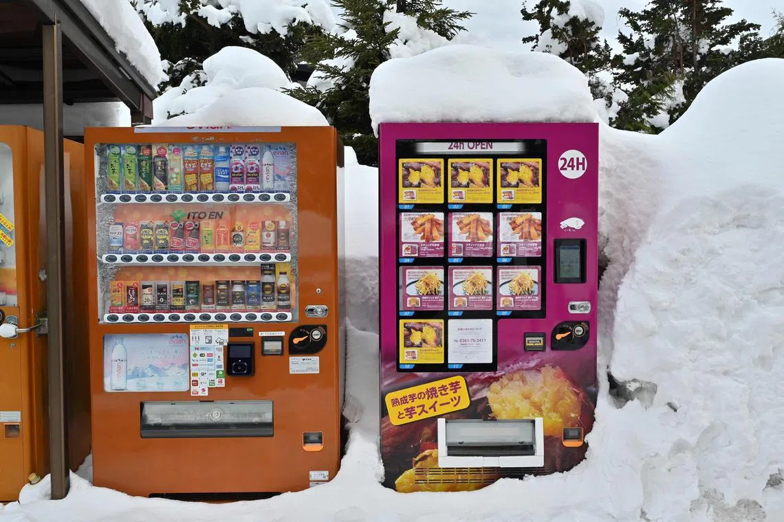 Vending machines covered in snow outside the ski resort town of Hakuba in Nagano on Feb 1 amid a whiteout that hit Japan for two weeks.