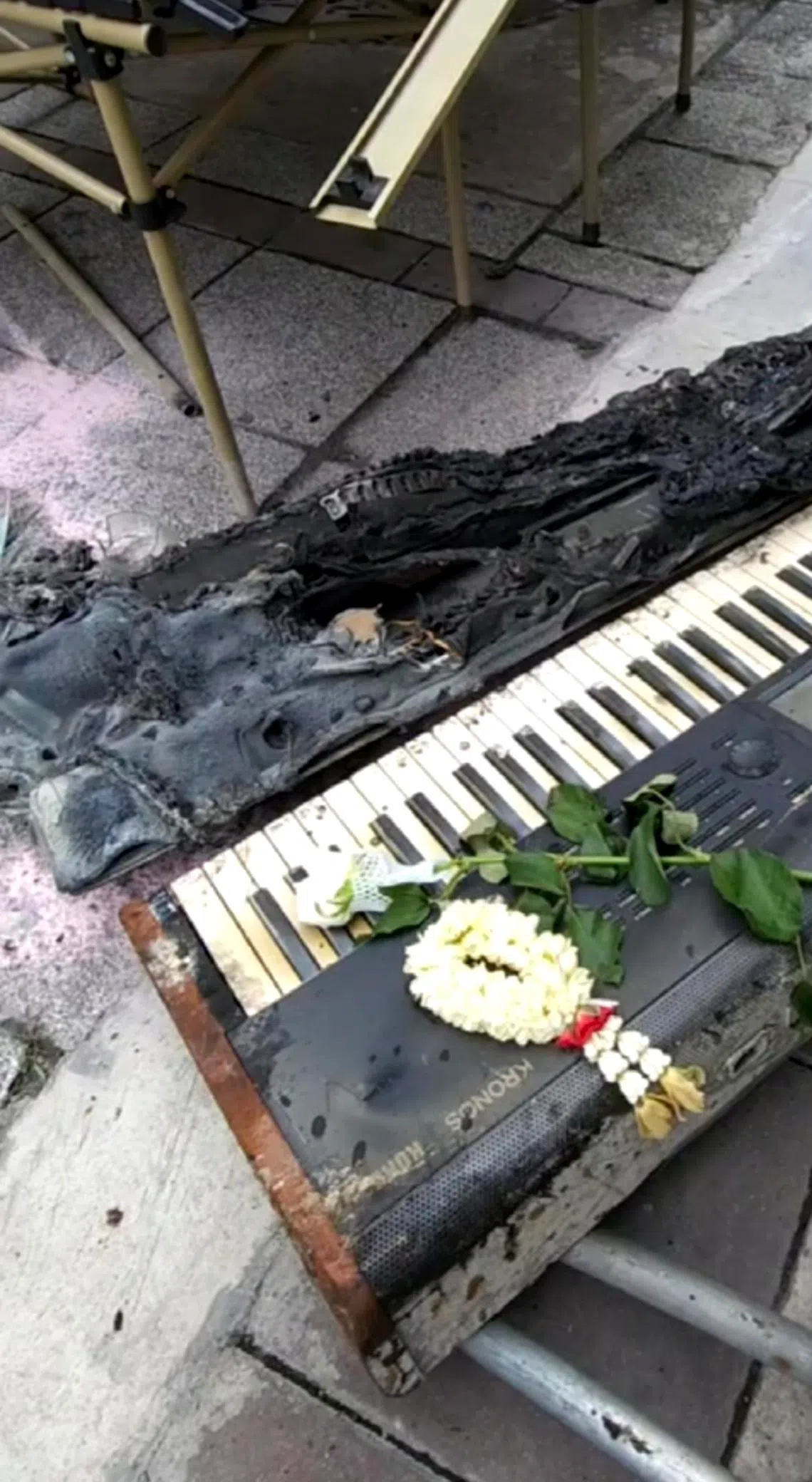 Burnt objects found outside the Rong Beer Na Lat Phrao bar in Bangkok, where a deadly fire had broken overnight into Monday.