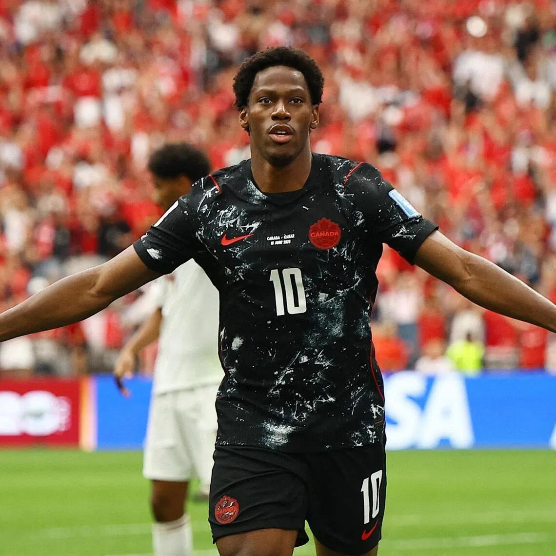 Canada's Jonathan David celebrates scoring their second goal against Qatar at the World Cup.