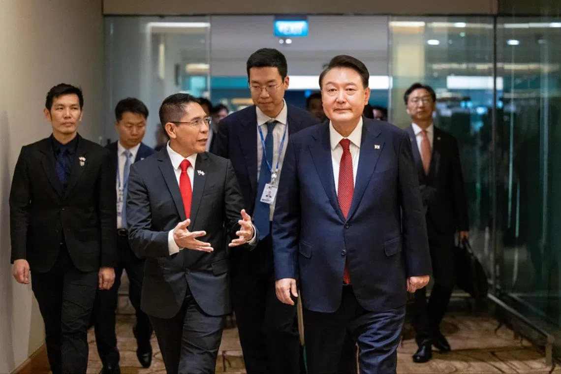 South Korean President Yoon Suk Yeol (right) was received by Second Minister for Foreign Affairs Dr Mohamad Maliki Osman on Oct 7.