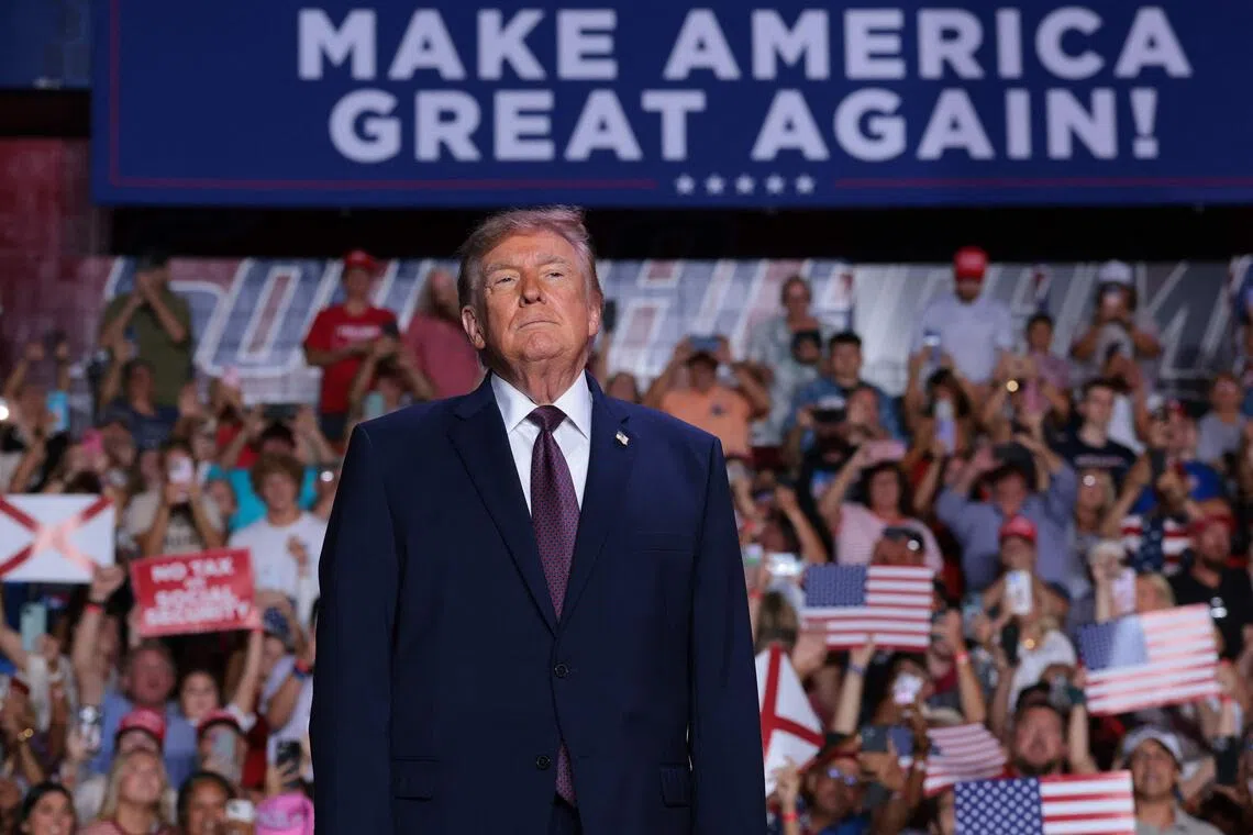 US President Donald Trump taking to the stage at a Republican campaign rally in Mobile, Alabama, on Oct 2. An enthusiasm gap among voters is favouring the Democrats in the US midterm elections.