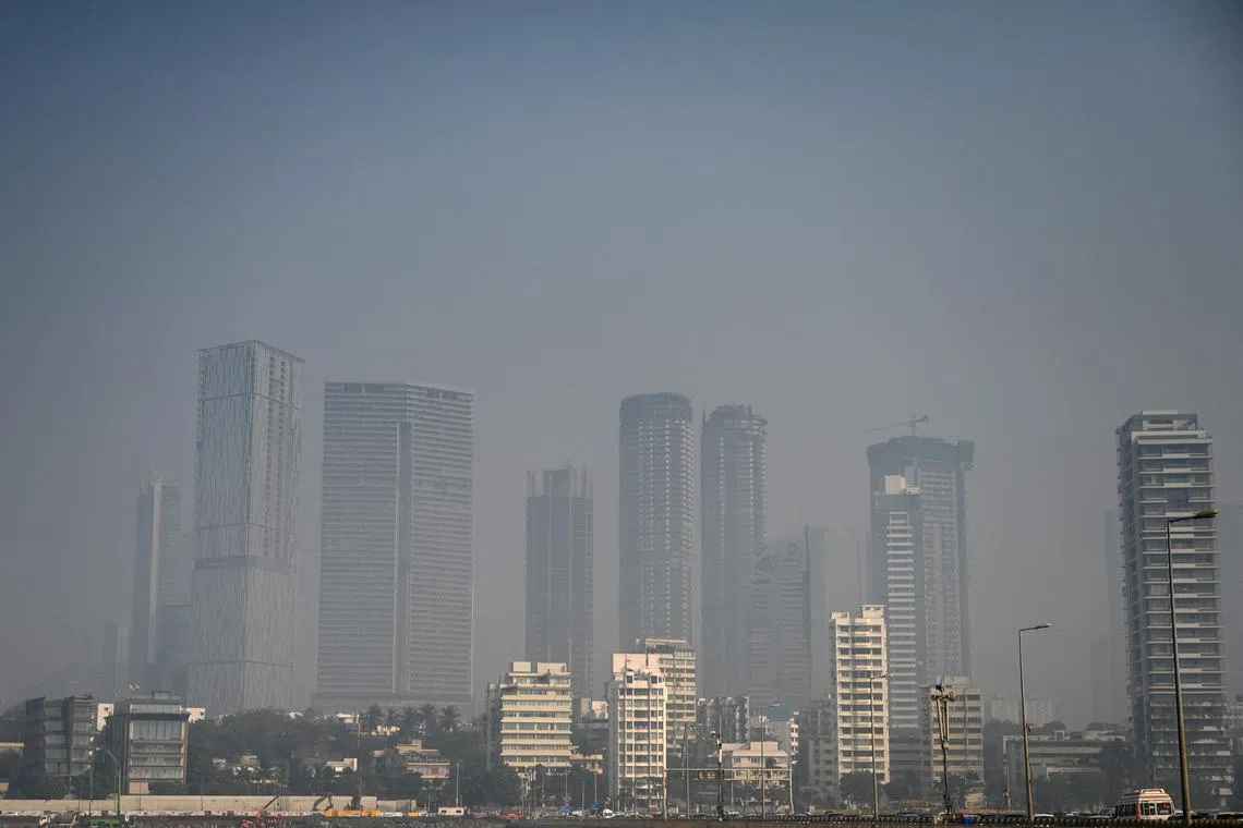 This photograph taken on January 31, 2023 shows city skyline on a hazy afternoon in Mumbai on January 31, 2023. (Photo by Punit PARANJPE / AFP)