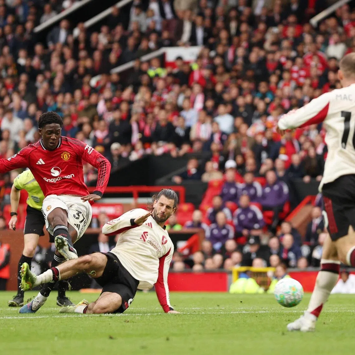 Kobbie Mainoo scoring Manchester United's  third goal during the X-X English Premier League XXX over Liverpool at Old Trafford on May 3, 2026.