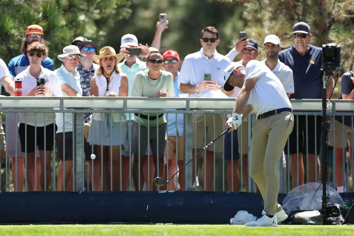 Keegan Bradley of the United States plays his shot from the 18th tee during the first round of the BMW Championship at Castle Pines Golf Club.