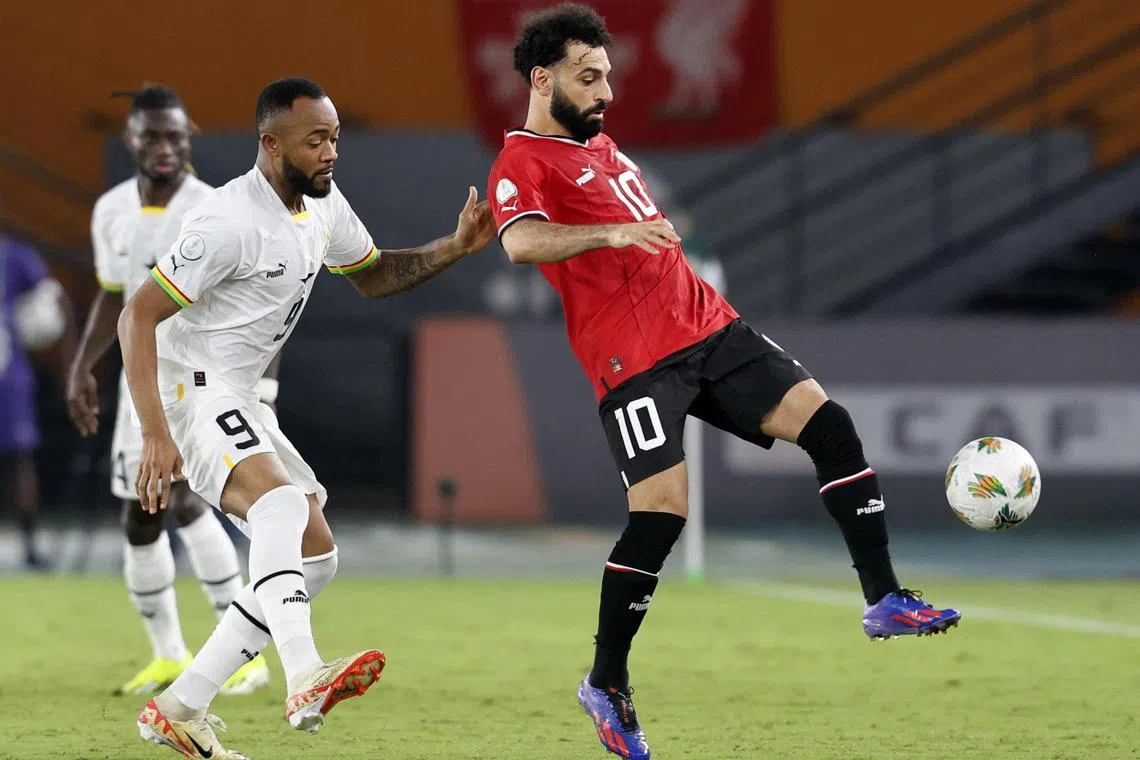 Egypt's Mohamed Salah (right) in action with Ghana's Jordan Ayew in the Africa Cup of Nations.