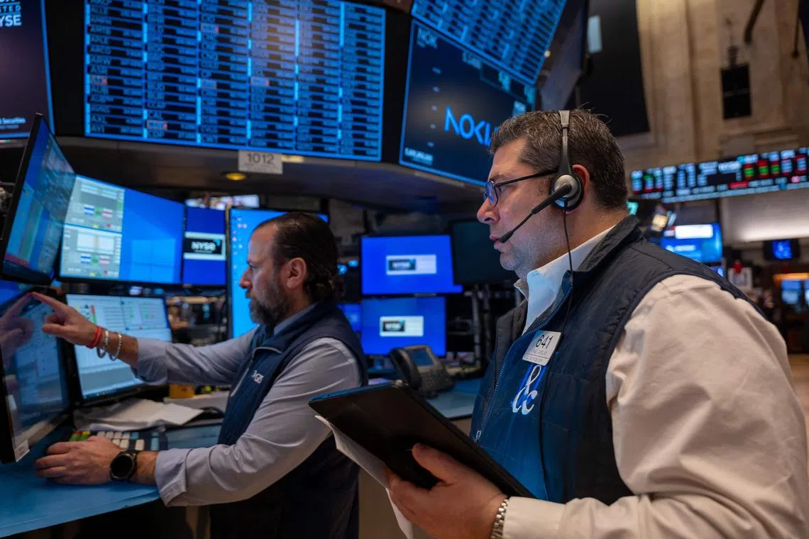Traders working on the floor of the New York Stock Exchange, on March 11, in New York City.